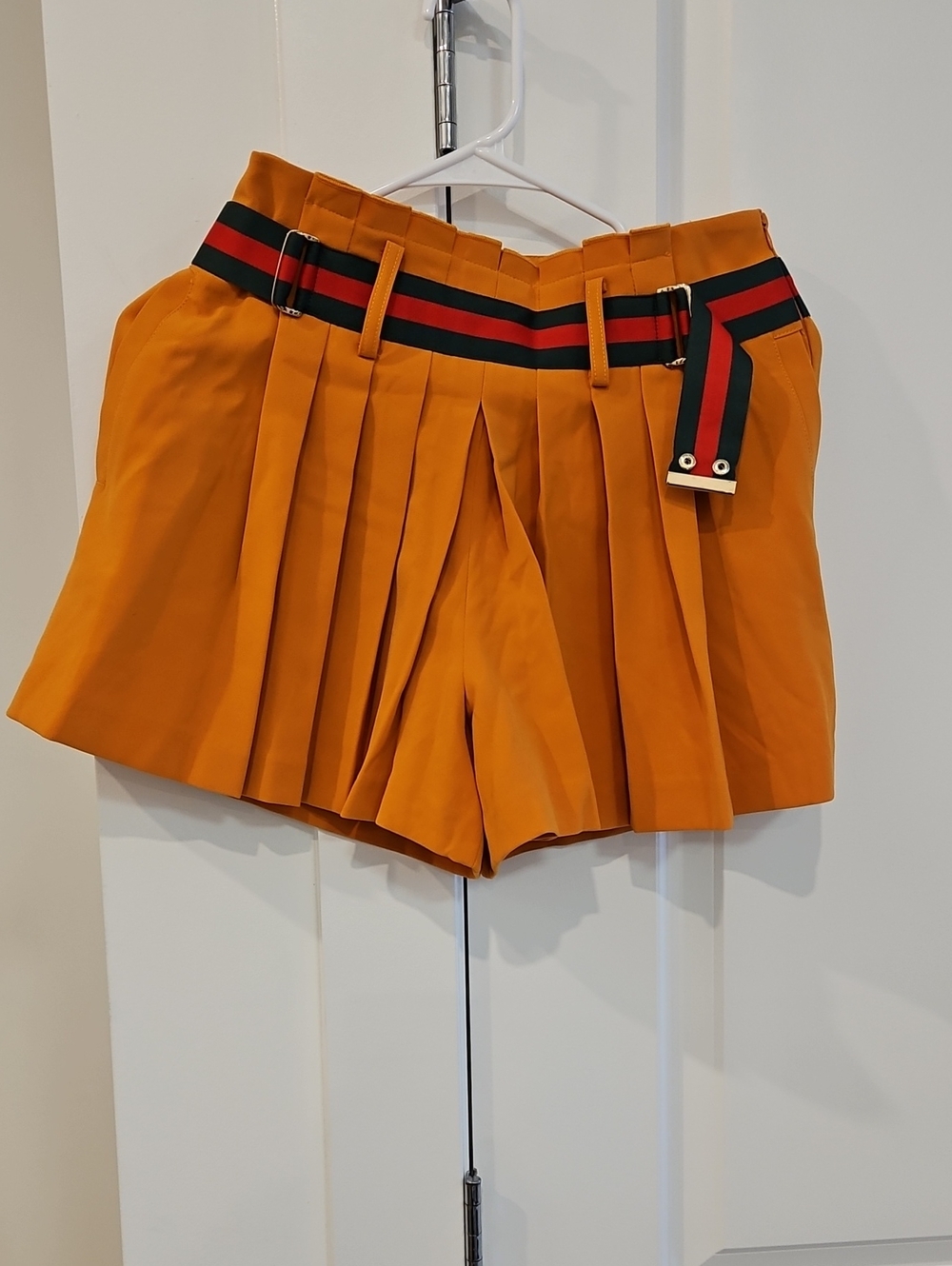 High-Waist Orange Pleated Skort with Striped Webbed Belt